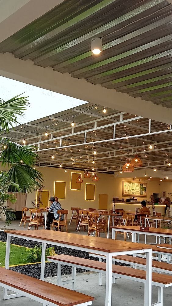Remote worker enjoying coffee and productivity in a cafe in Abuja.